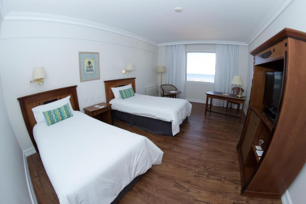 Letto o letti in una camera di Lucania Palazzo Hotel