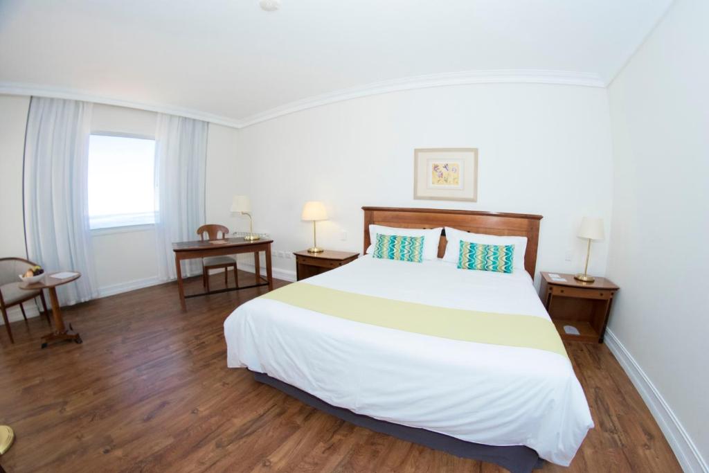 Letto o letti in una camera di Lucania Palazzo Hotel