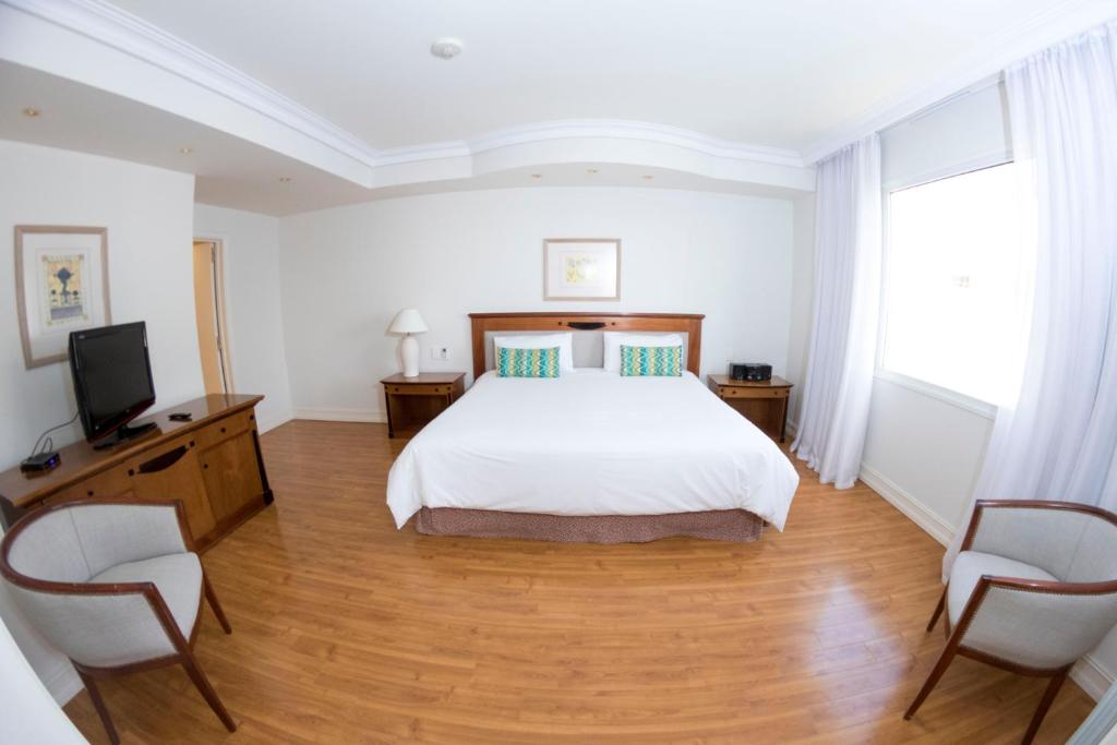 Letto o letti in una camera di Lucania Palazzo Hotel