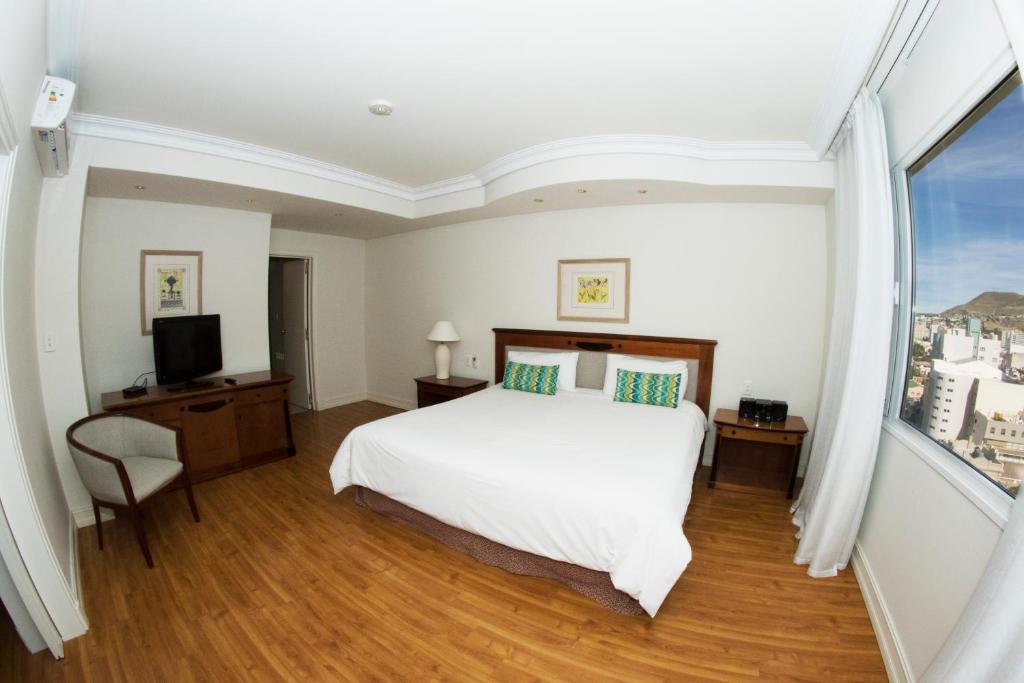 Letto o letti in una camera di Lucania Palazzo Hotel