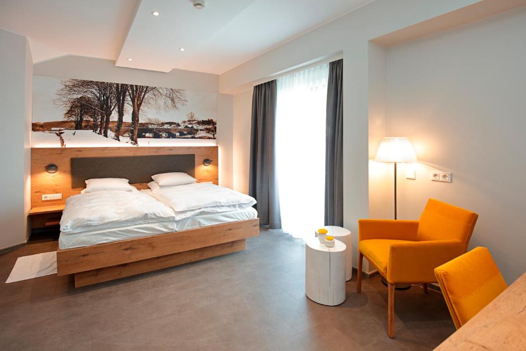 Postel nebo postele na pokoji v ubytování Hotel - Restaurant DAHM