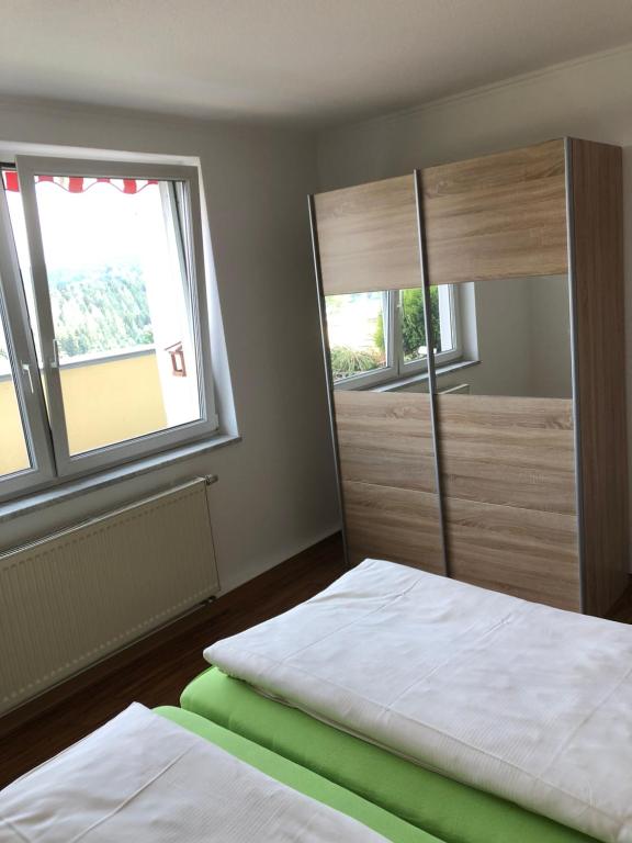 Postel nebo postele na pokoji v ubytování Hotel Falkenstein