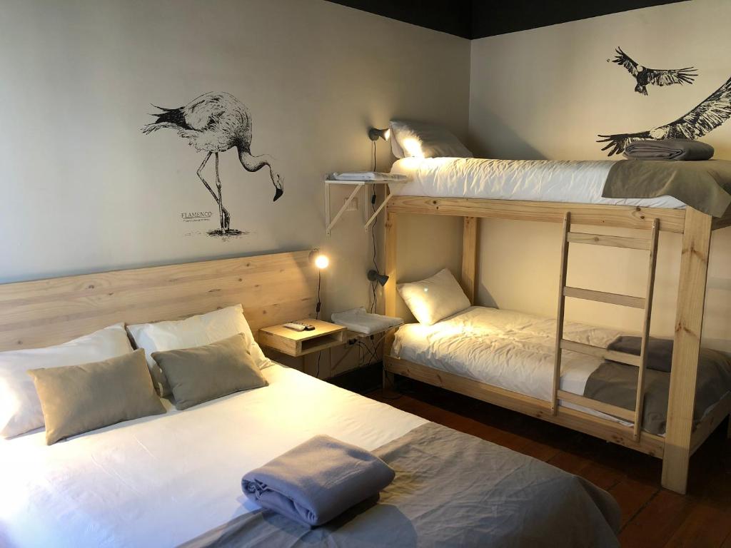 Voodi või voodid majutusasutuse Hostel Boutique Merced 88 toas