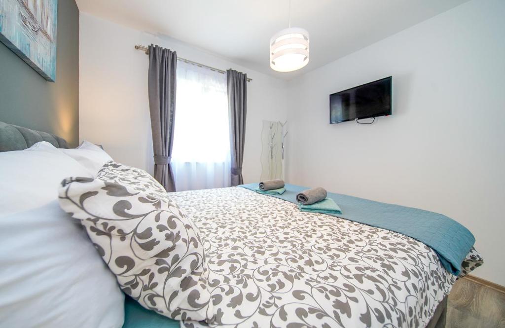 Postel nebo postele na pokoji v ubytování Apartmani Ponta