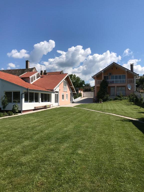 a large yard in front of a house at Guesthouse Rebel in Deliblato