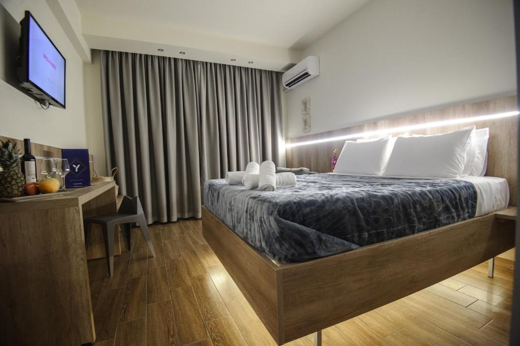 Postel nebo postele na pokoji v ubytování Hotel Yakinthos
