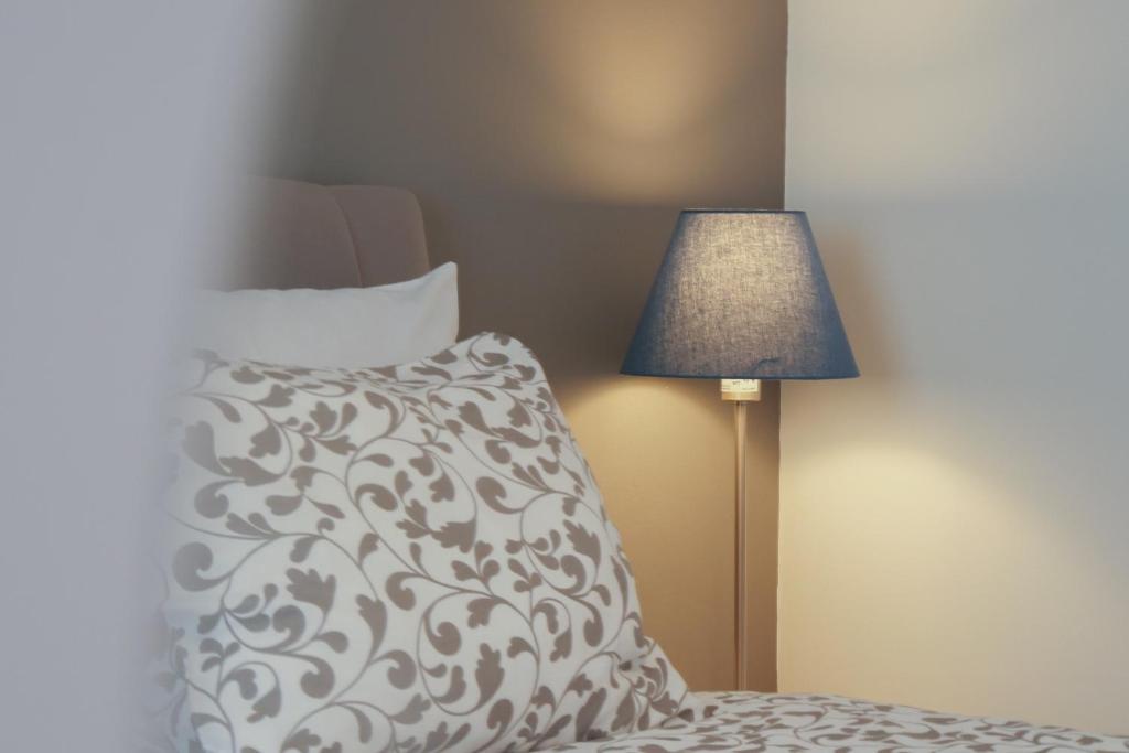 Postel nebo postele na pokoji v ubytování Apartmani Ponta