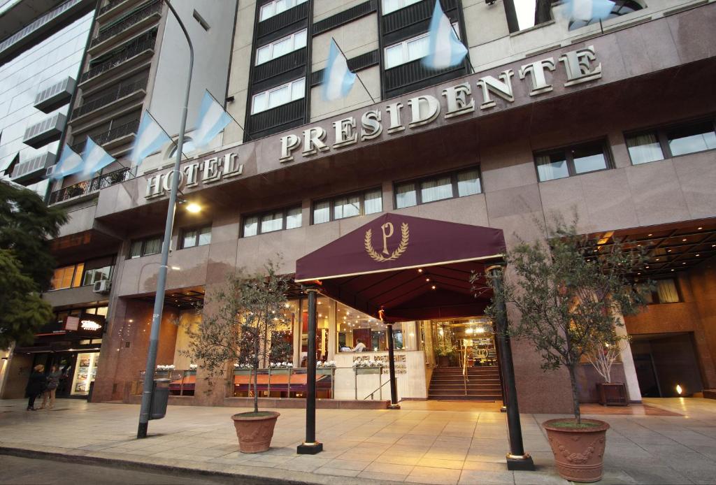 a building with a sign that reads hotel presidentialitute at Hotel Presidente Buenos Aires in Buenos Aires