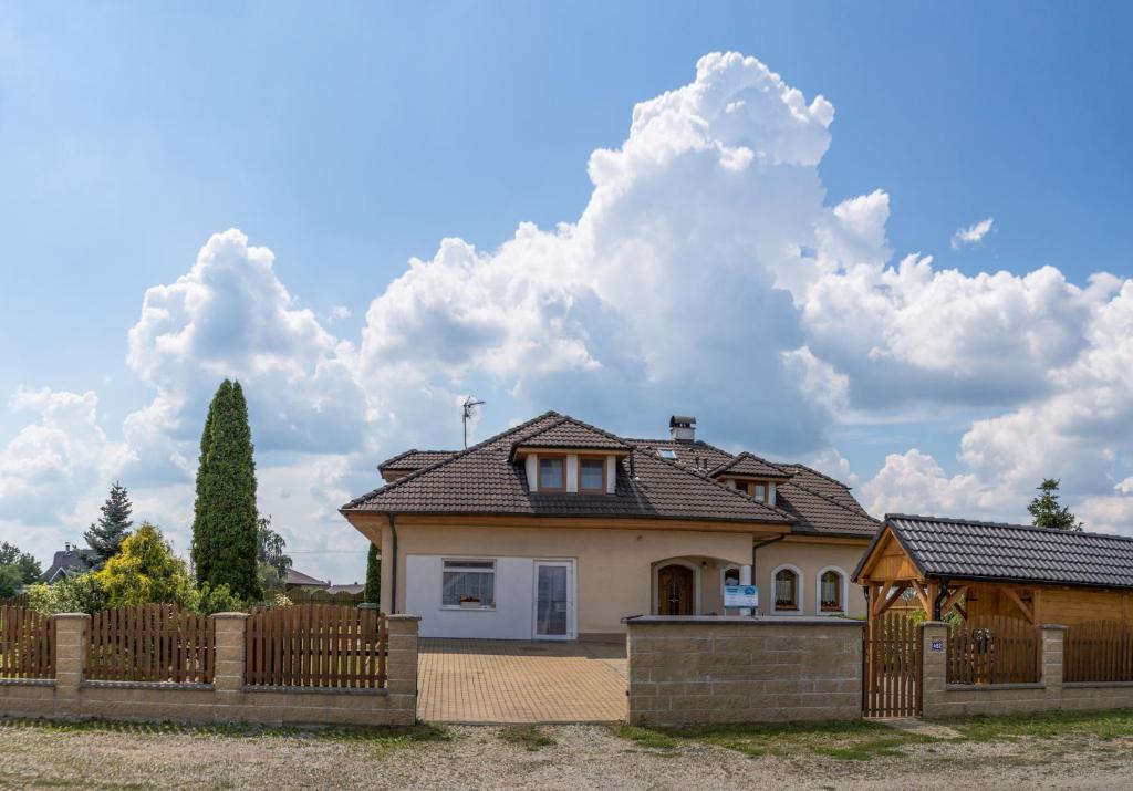 a house with a fence in front of it at ubytování u Smolíků in Třeboň