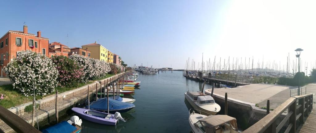 a group of boats are docked in a canal at Appartamento Sant'Elena in Venice