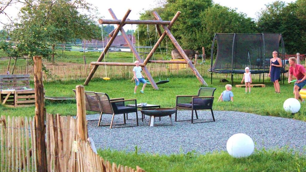 a group of children playing in a playground at Allgäu Ferienhof Schönberger in Argenbühl