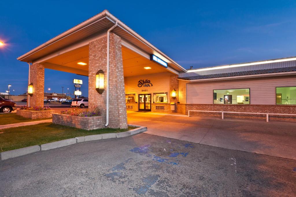 a building with a parking lot in front of it at Shilo Inn Elko in Elko