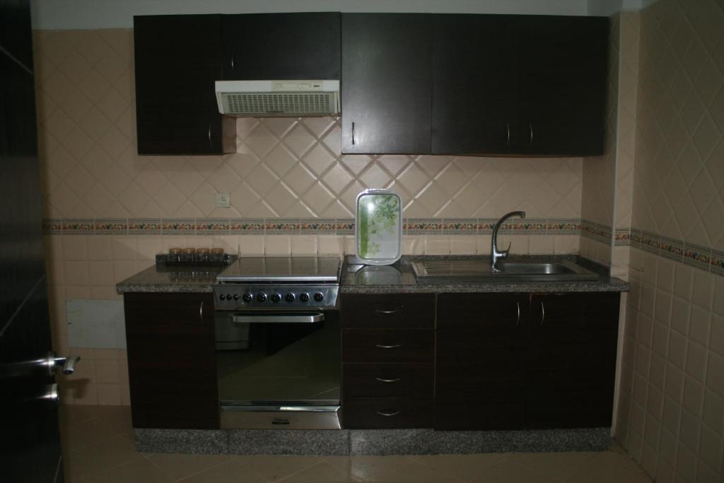Kuchyň nebo kuchyňský kout v ubytování Appartement de Mustapha larache
