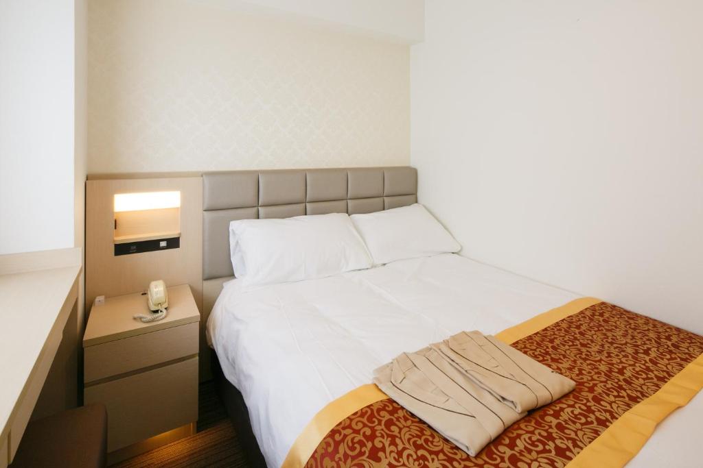 Postel nebo postele na pokoji v ubytování Day Nice Hotel Tokyo