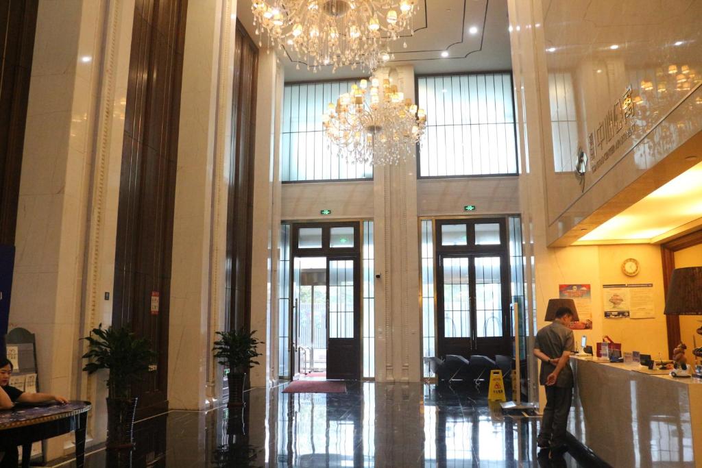 Vstupní hala nebo recepce v ubytování Qingdao Elegant Central Apartment