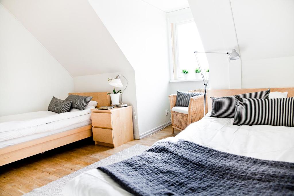 Postel nebo postele na pokoji v ubytování Abbekås Golfrestaurang & Hotell