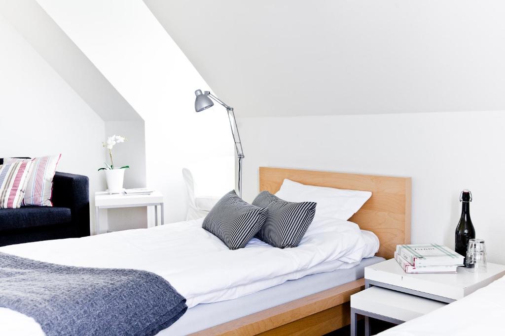 Postel nebo postele na pokoji v ubytování Abbekås Golfrestaurang & Hotell