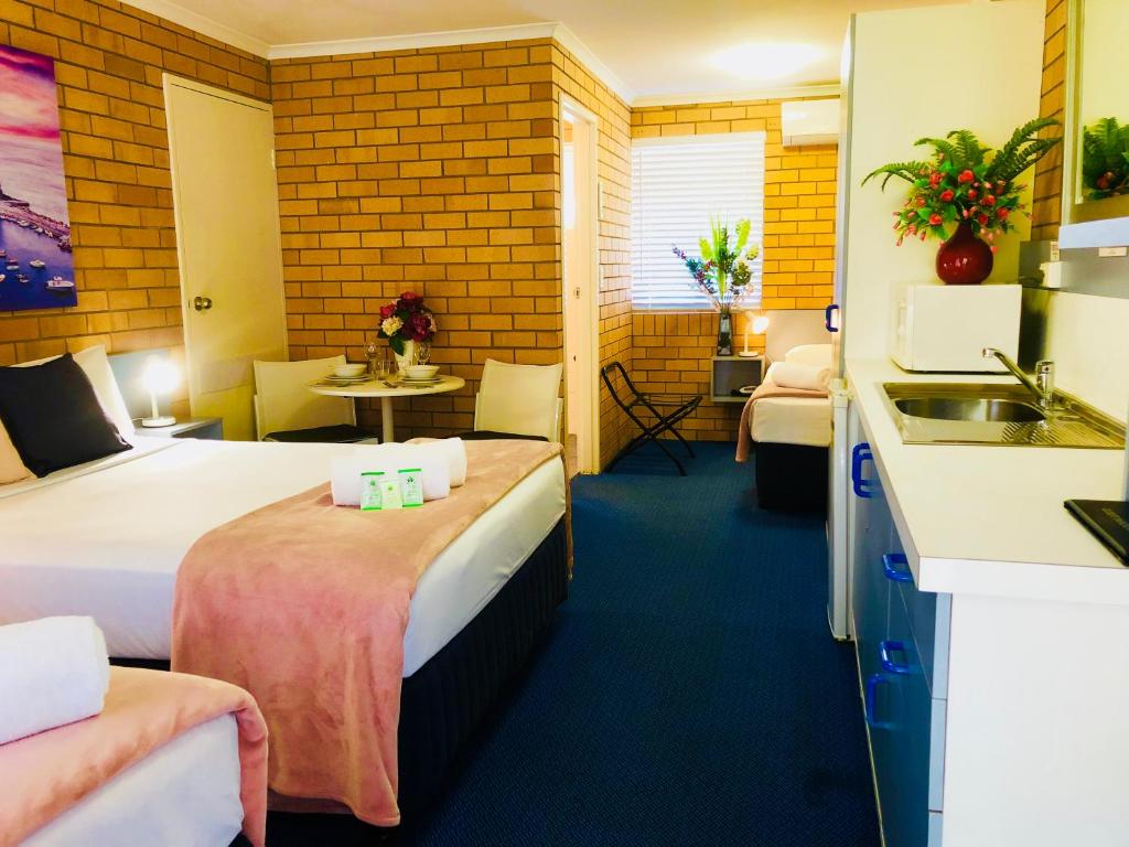 Postel nebo postele na pokoji v ubytování Bosuns Inn Motel