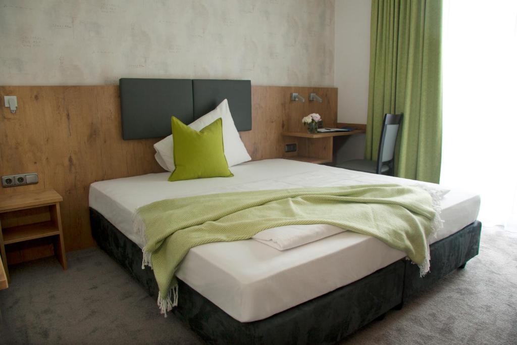 Ένα ή περισσότερα κρεβάτια σε δωμάτιο στο Boardinghouse Landshut