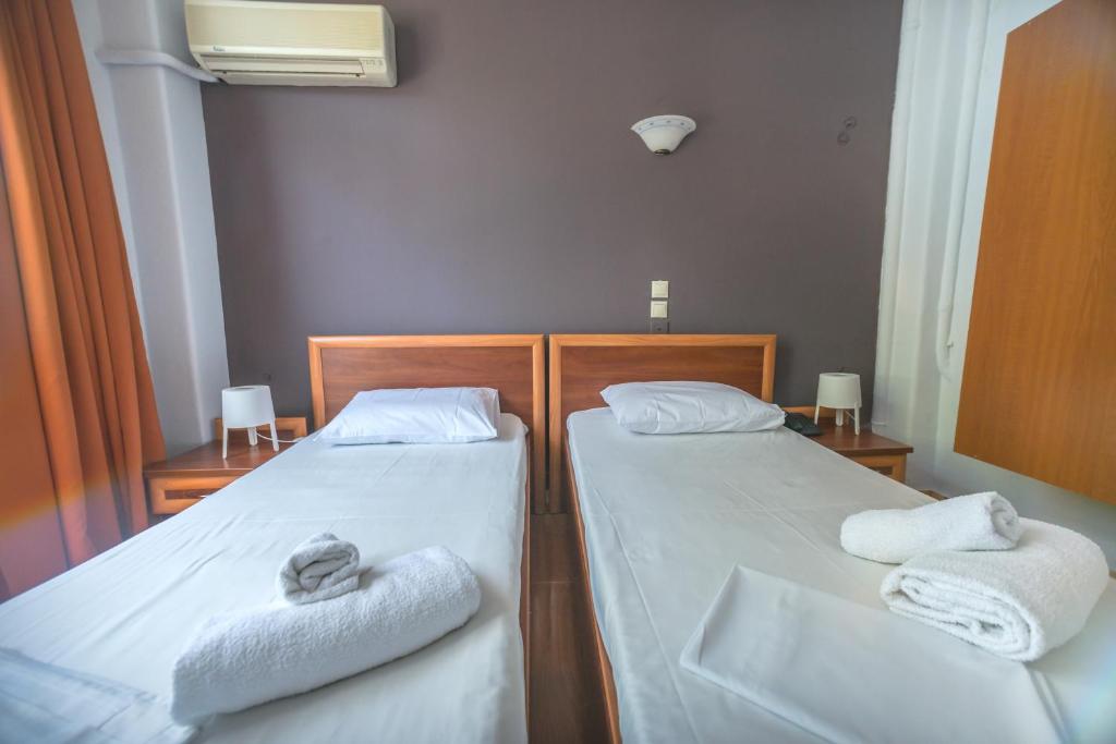 Postel nebo postele na pokoji v ubytování Hotel Akti