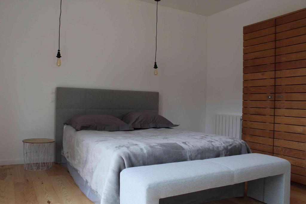 Postel nebo postele na pokoji v ubytování Chambres d'Hôtes 1001 NUITS Montalivet