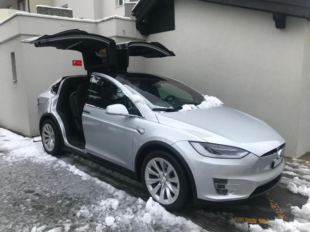 a silver car with its doors open in the snow at Adhhoc Hotel in Naters