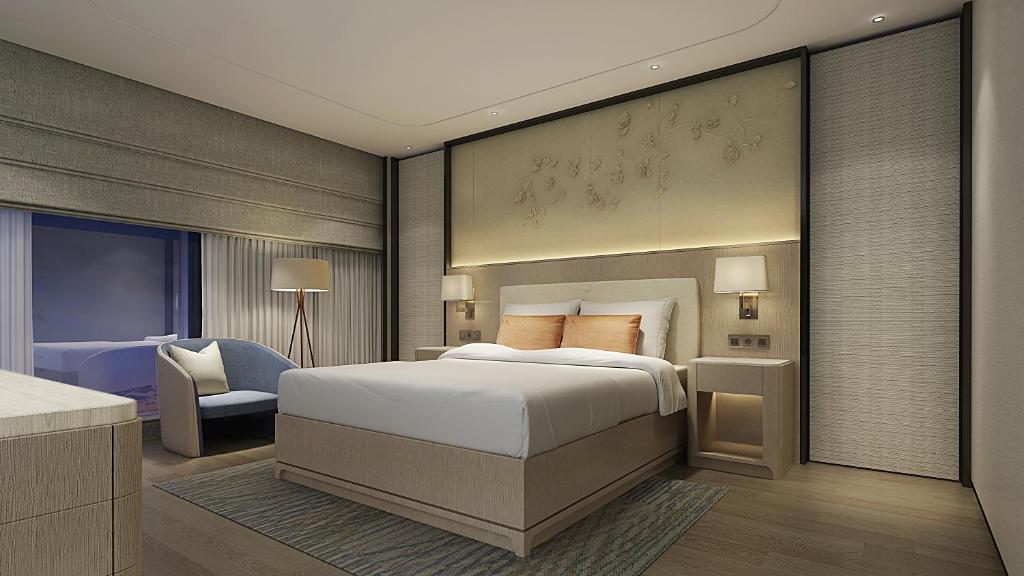 Ліжко або ліжка в номері Howard Johnson Zhujiang Hotel Chongqing