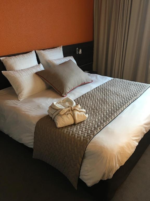 Postel nebo postele na pokoji v ubytování Best Western Alexander Park Chambéry