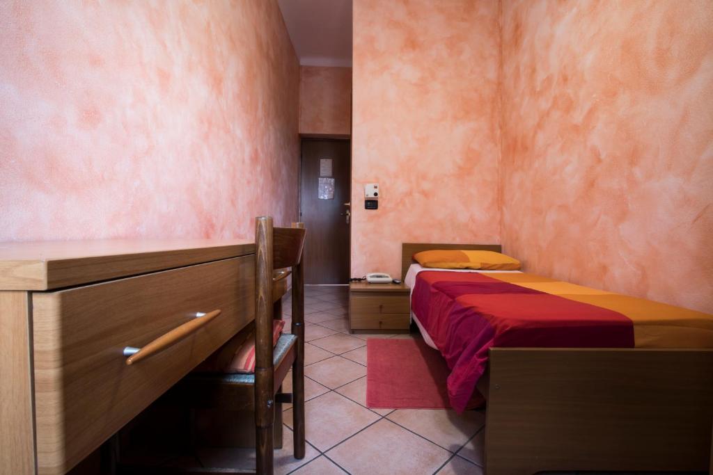 Postel nebo postele na pokoji v ubytování Albergo Ristorante Brera