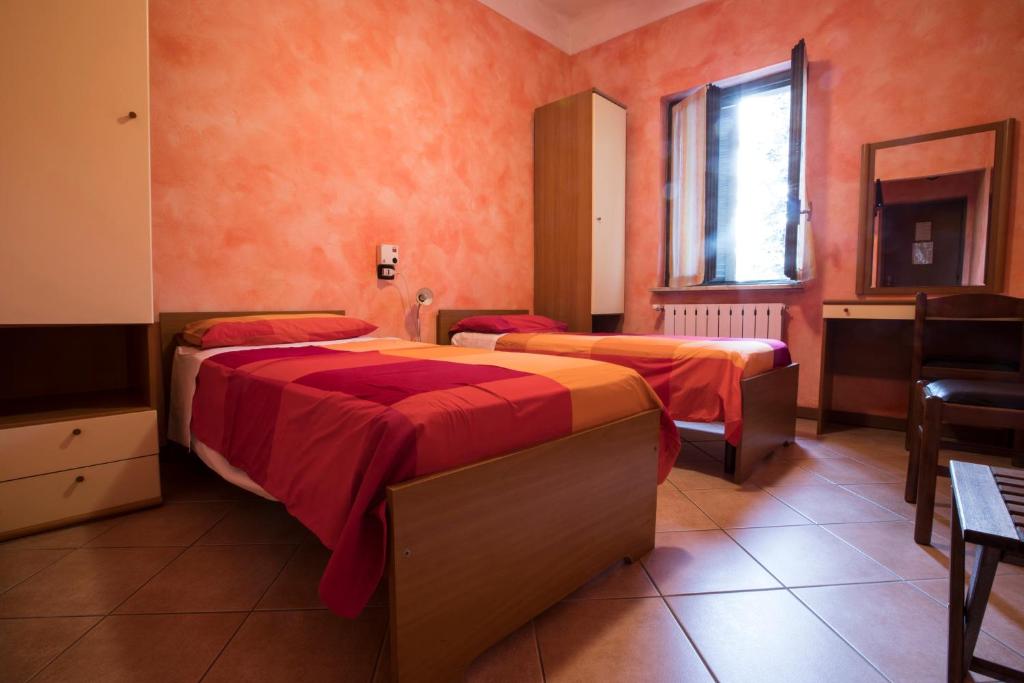 Postel nebo postele na pokoji v ubytování Albergo Ristorante Brera