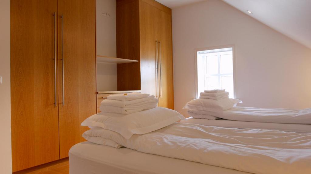 Postel nebo postele na pokoji v ubytování Askja Apartment