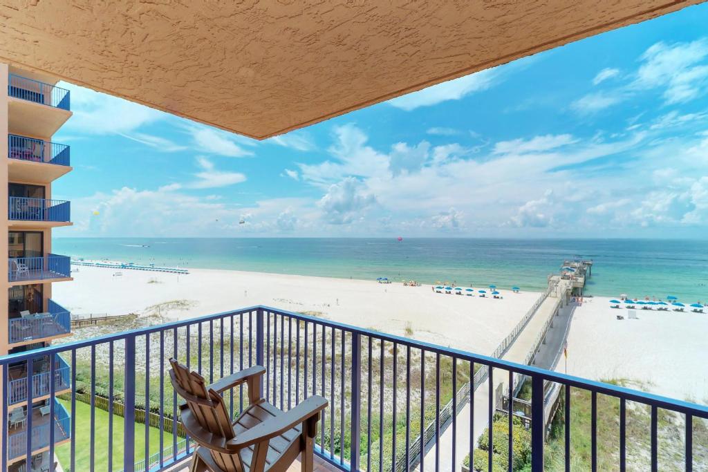 a balcony with a view of the beach at Four Seasons 501W in Orange Beach