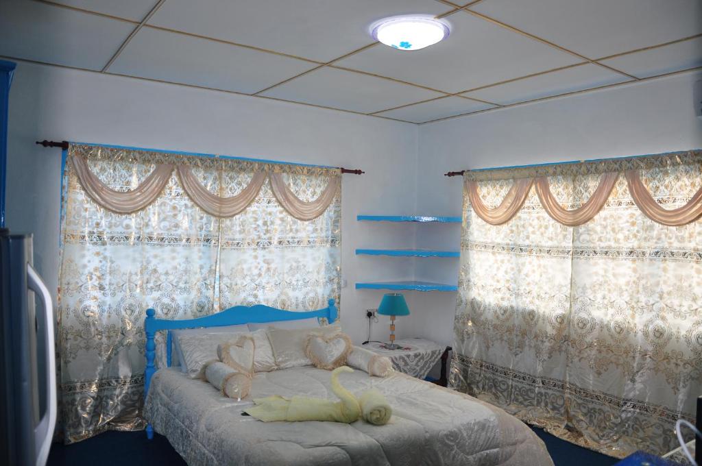 Postel nebo postele na pokoji v ubytování Le Chateau Bleu