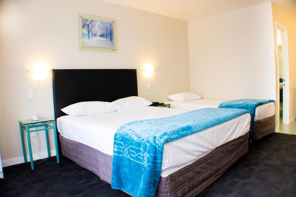 Postel nebo postele na pokoji v ubytování Rayland Motel