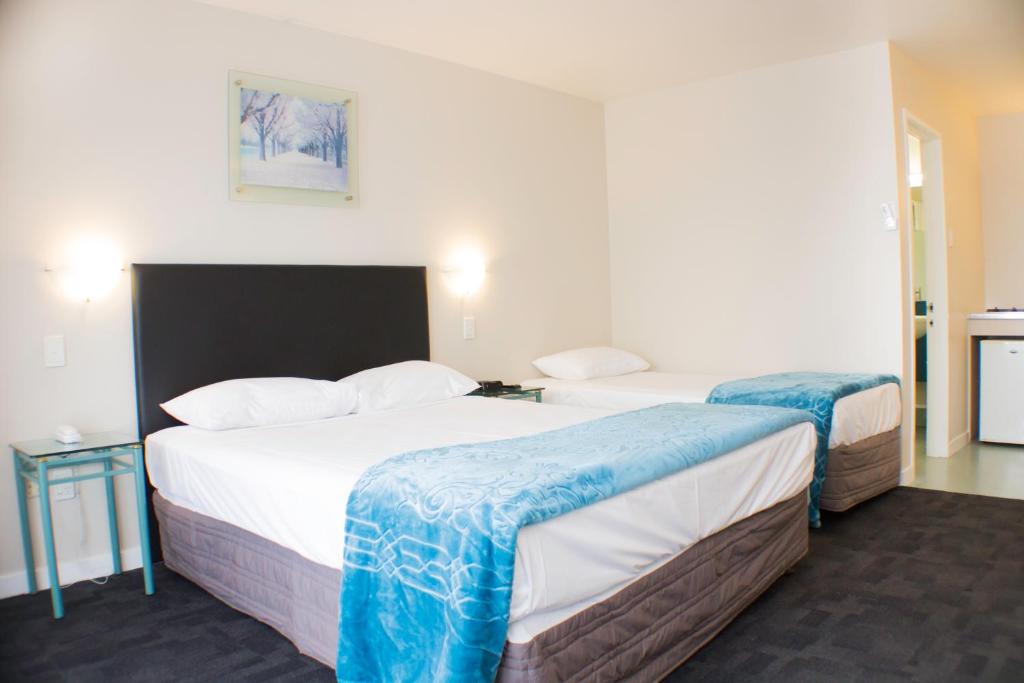 Postel nebo postele na pokoji v ubytování Rayland Motel