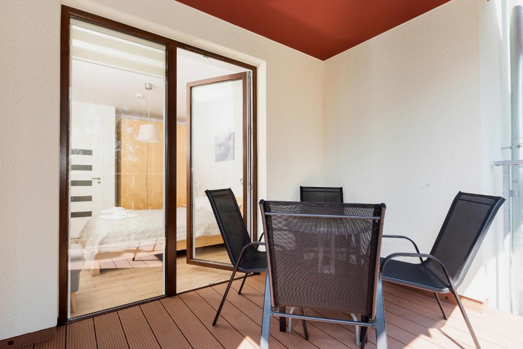 Posteľ alebo postele v izbe v ubytovaní Apartamenty Polanki Park BASEN, SAUNA & SIŁOWNIA by Noclegi Renters