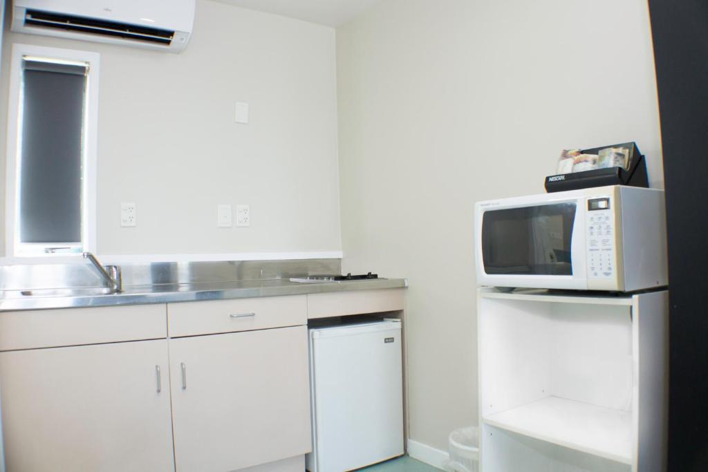 Kuchyň nebo kuchyňský kout v ubytování Rayland Motel