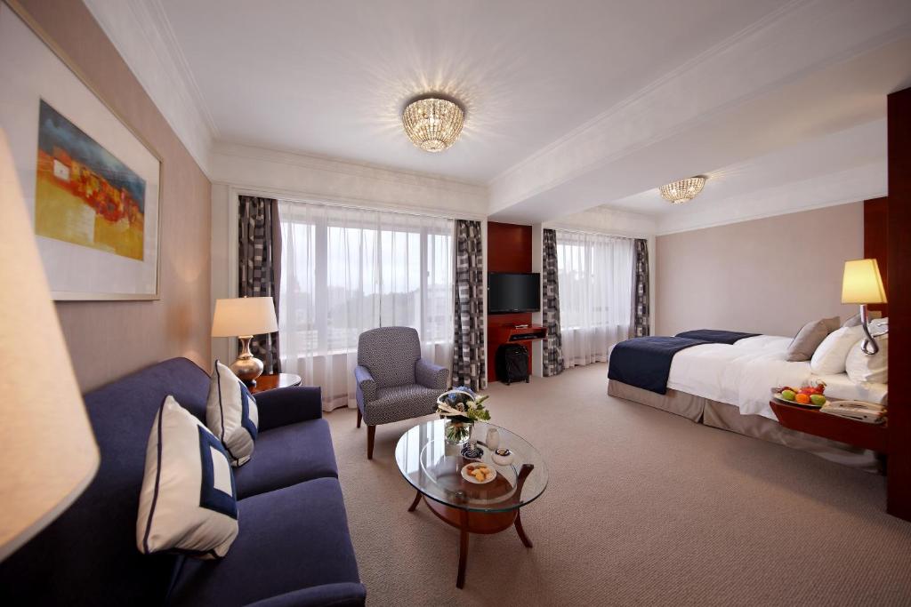 Postel nebo postele na pokoji v ubytování Hotel Royal Macau