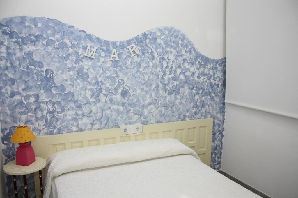 Postel nebo postele na pokoji v ubytování Piso Capri 2 Inmomart
