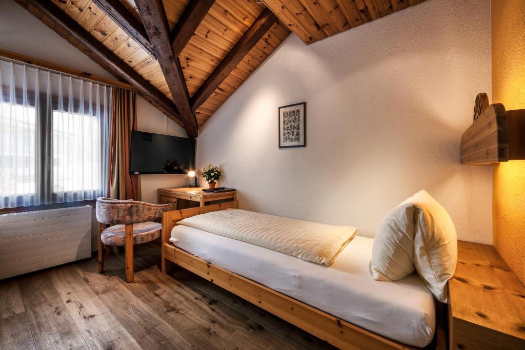 Postel nebo postele na pokoji v ubytování Hotel Astoria