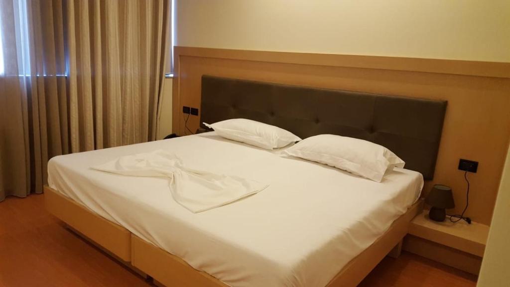 Postel nebo postele na pokoji v ubytování Icon Hotel