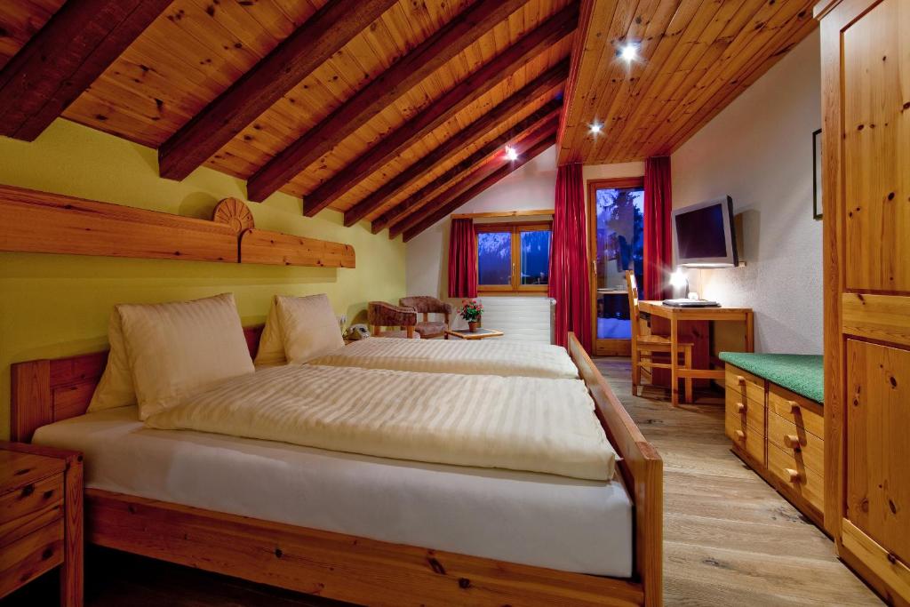 Postel nebo postele na pokoji v ubytování Hotel Astoria