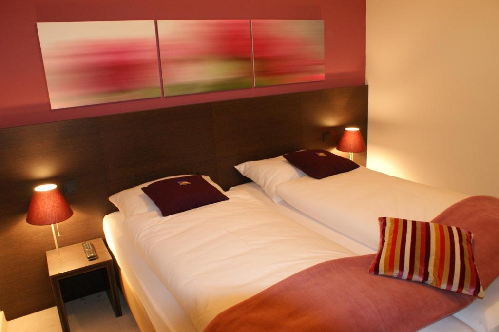 Postel nebo postele na pokoji v ubytování KH Hotel mit Restaurant