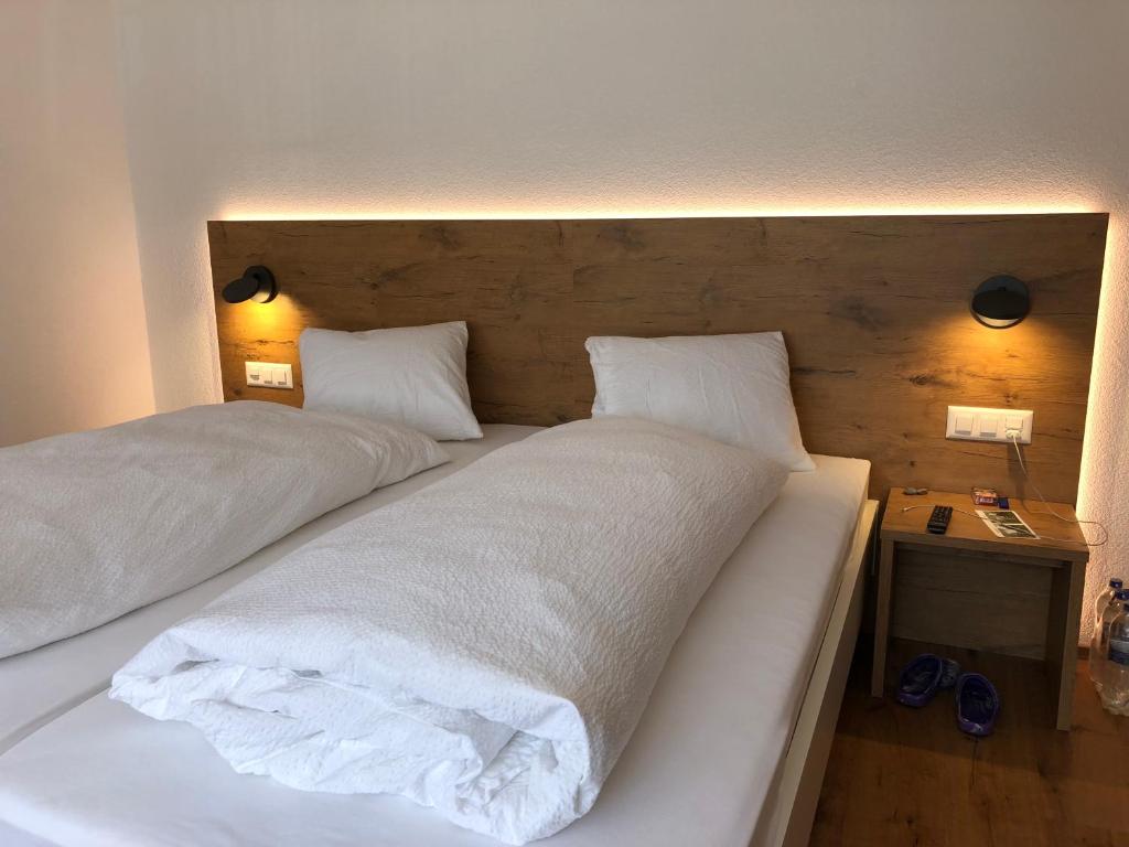 Postel nebo postele na pokoji v ubytování Hotel Walser