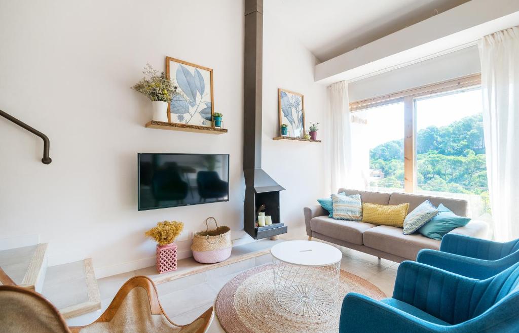 Televízia a/alebo spoločenská miestnosť v ubytovaní Casa Dolce Riera I - Sa Riera (Begur)