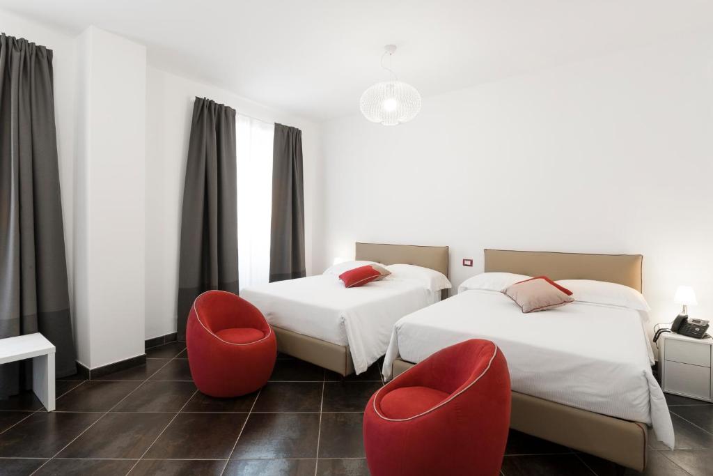 Postel nebo postele na pokoji v ubytování Interamnia Boutique Hotel