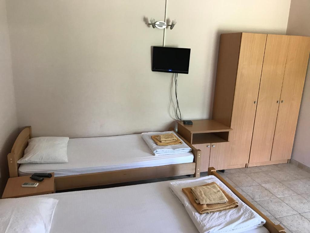 Postel nebo postele na pokoji v ubytování Apartmani Tomovic