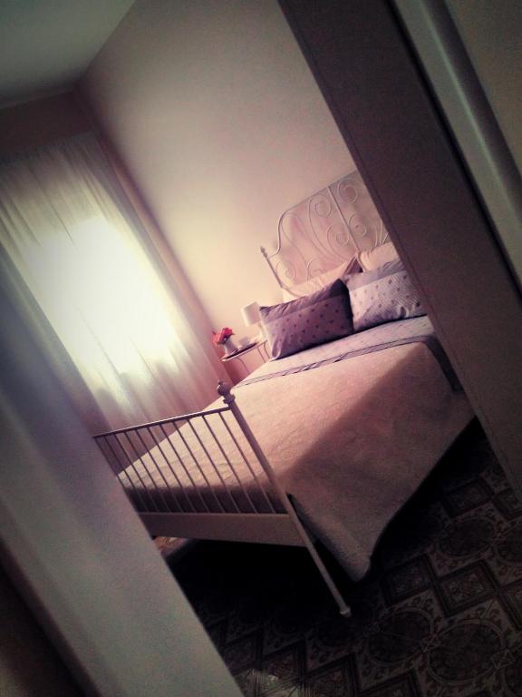 Postel nebo postele na pokoji v ubytování B&B L'angolo fiorito