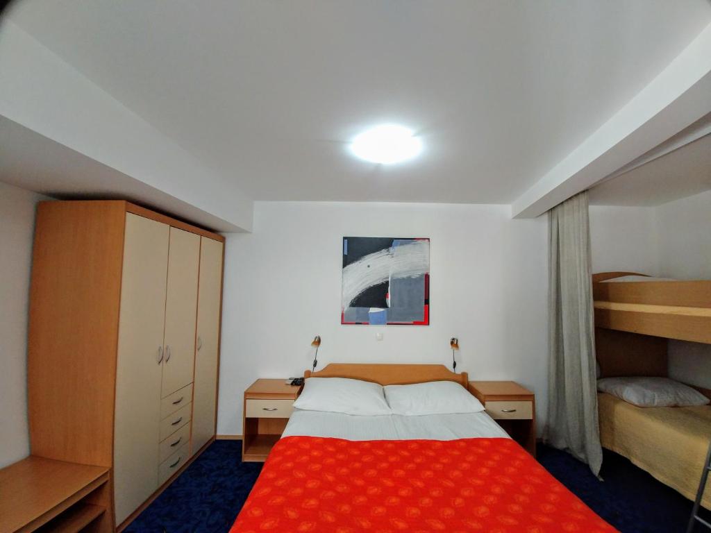 Postel nebo postele na pokoji v ubytování Hotel garni Paleta