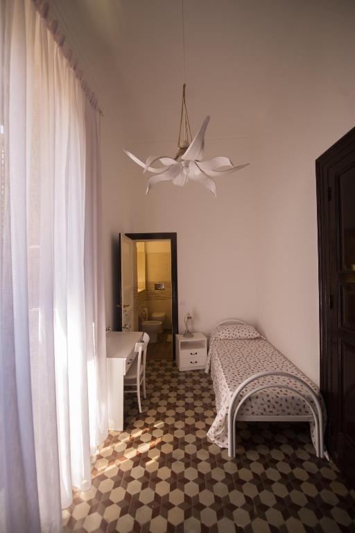 Łóżko lub łóżka w pokoju w obiekcie Villa le Torri B&B